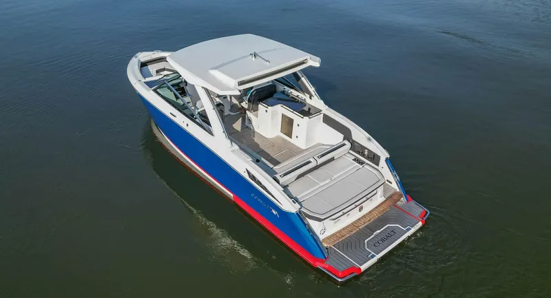 Slide: The Image of 2023 Cobalt R33 boat on water, featuring sleek design and spacious deck. - 7
