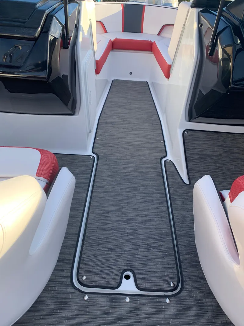 Slide: The Image of 2023 Scarab 195 ID boat interior with red and white seating. - 15