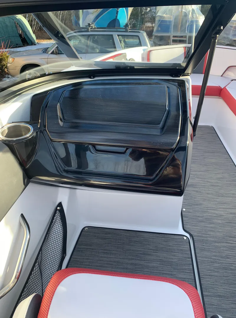 Slide: The Image of 2023 Scarab 195 ID boat interior with modern seating and storage. - 18