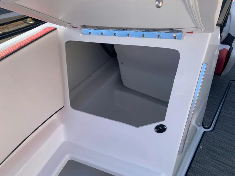 Slide: The Image of 2023 Scarab 195 ID boat storage compartment with open hatch. - 26