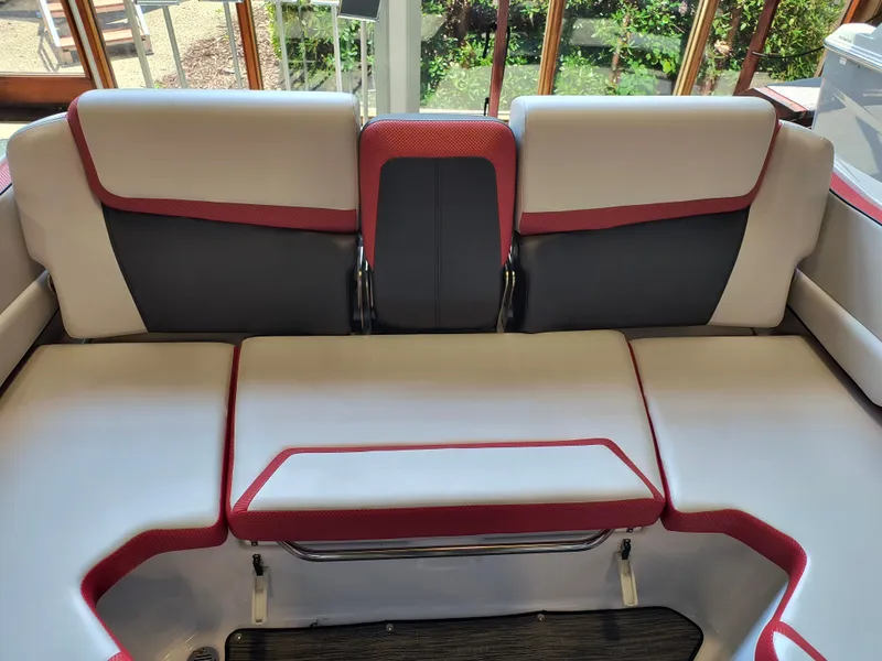 Slide: The Image of 2023 Scarab 195 ID boat interior with red and white seating, modern design. - 29