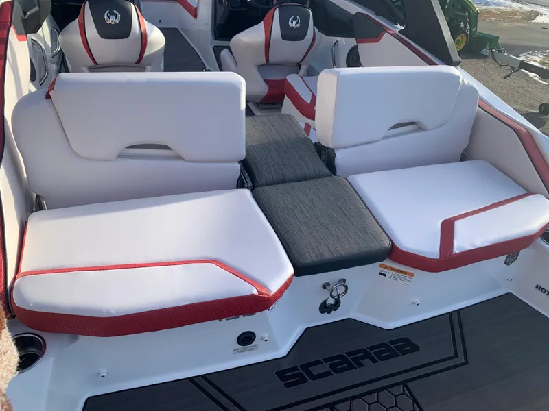 Slide: The Image of 2023 Scarab 195 ID boat interior with white and red seating. - 9