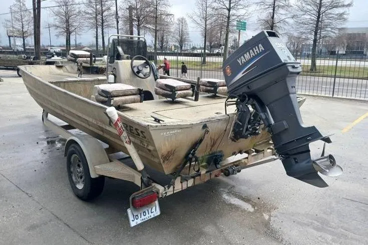 Slide: The Image of 2004 Xpress XP18CC boat with Yamaha outboard motor on a trailer. - 3