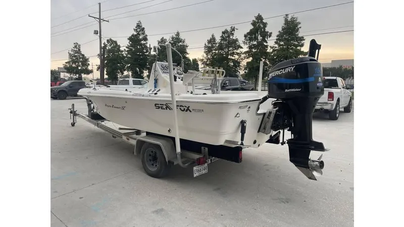 Slide: The Image of 2005 Sea Fox 205 Bay Fisher boat on trailer with Mercury outboard motor. - 10