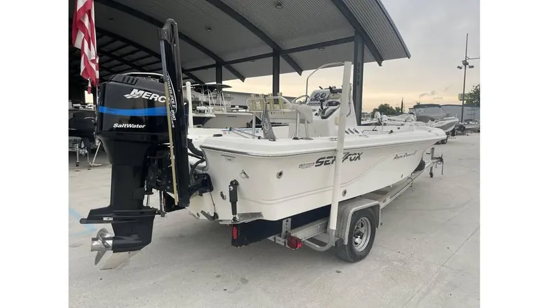Slide: The Image of 2005 Sea Fox 205 Bay Fisher boat on trailer, featuring Mercury outboard motor. - 12