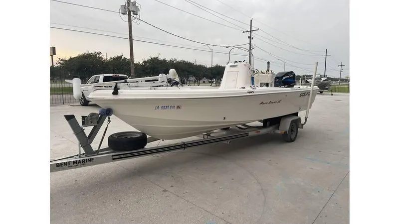 Slide: The Image of 2005 Sea Fox 205 Bay Fisher boat on trailer in parking lot. - 8