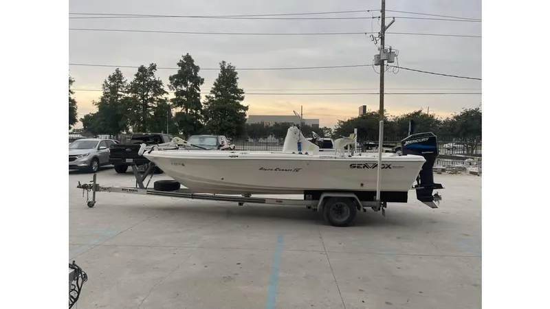 Slide: The Image of 2005 Sea Fox 205 Bay Fisher boat on trailer in parking lot. - 9