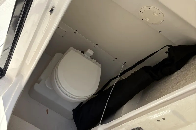 Slide: The Image of 2022 Robalo R230 Center Console boat seat with logo, featuring sleek design and comfortable padding. - 14