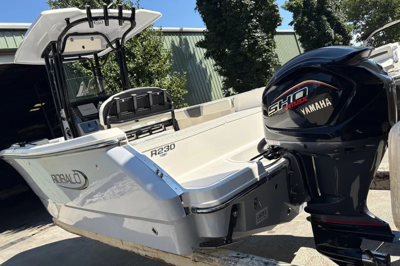 Slide: The Image of 2022 Robalo R230 Center Console boat with Yamaha engine on a trailer. - 3