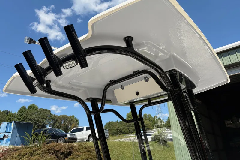 Slide: The Image of 2022 Robalo R230 Center Console boat with Yamaha engine, docked outdoors. - 4