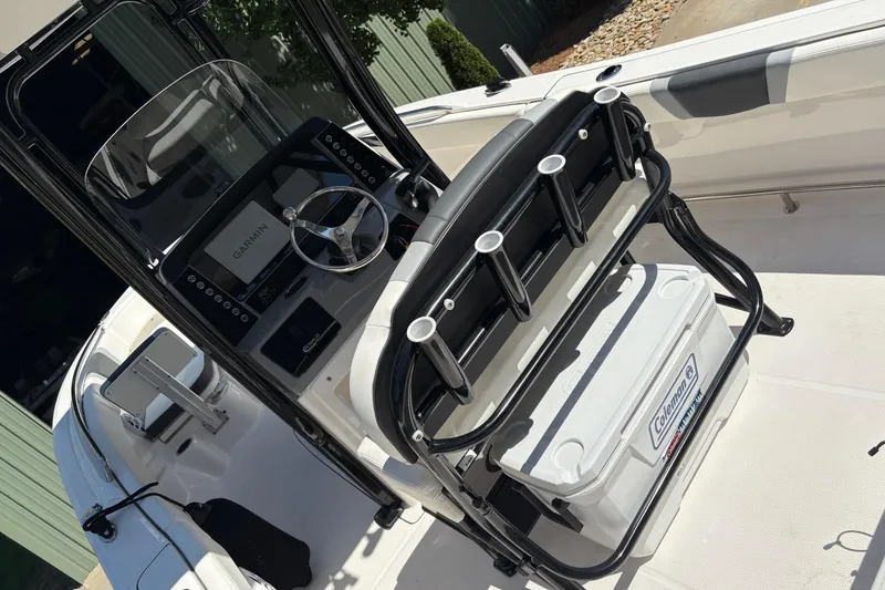 Slide: The Image of 2022 Robalo R230 Center Console boat with spacious seating and sleek design. - 7