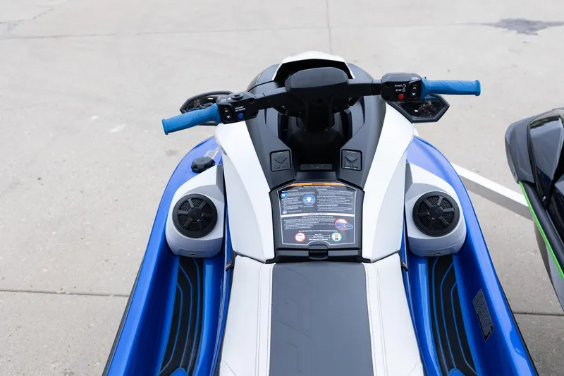 Slide: The Image of 2023 Kawasaki Jetski Ultra 310LX-S, blue and white, top view of handlebars and seat. - 13