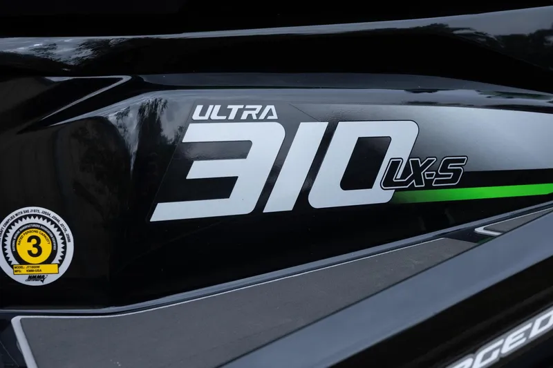 Slide: The Image of 2023 Kawasaki Jetski Ultra 310LX-S logo on sleek black surface. - 20