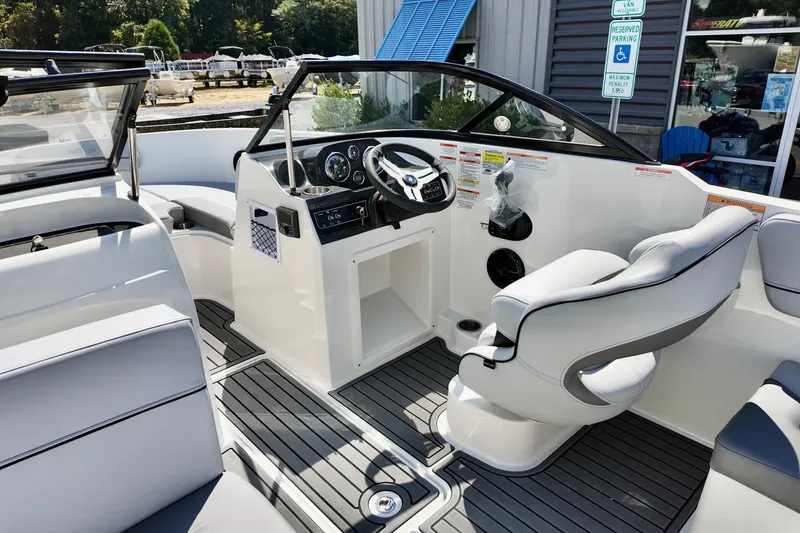 Slide: The Image of 2025 Bayliner VR4 Bowrider OB interior with modern helm and seating. - 8