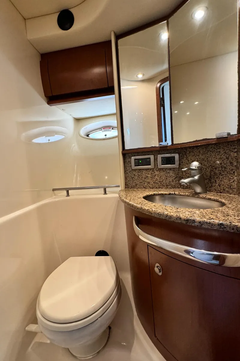 Slide: The Image of 2007 Sea Ray 44 Sundancer yacht bathroom with modern fixtures and granite countertop. - 19
