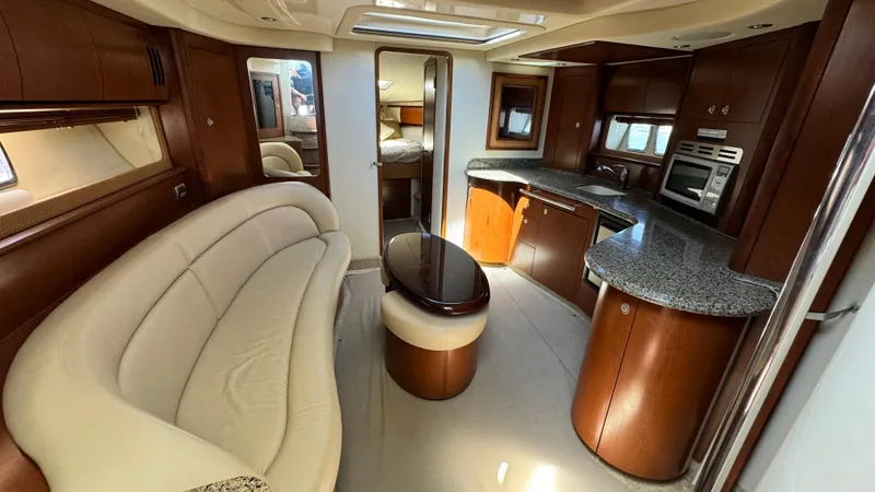 Slide: The Image of Luxurious interior of 2007 Sea Ray 44 Sundancer yacht with elegant seating and modern kitchen. - 2