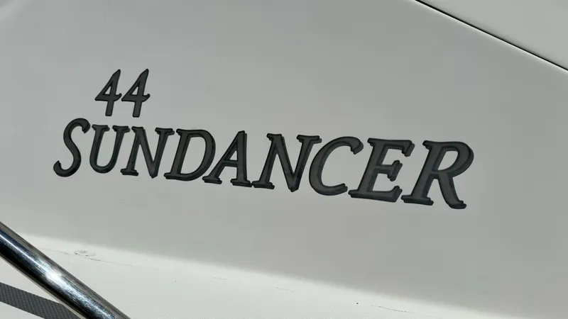 Slide: The Image of 2007 Sea Ray 44 Sundancer boat nameplate in bold lettering. - 3