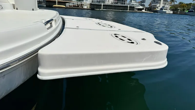 Slide: The Image of 2007 Sea Ray 44 Sundancer swim platform on calm water, showcasing sleek design. - 5