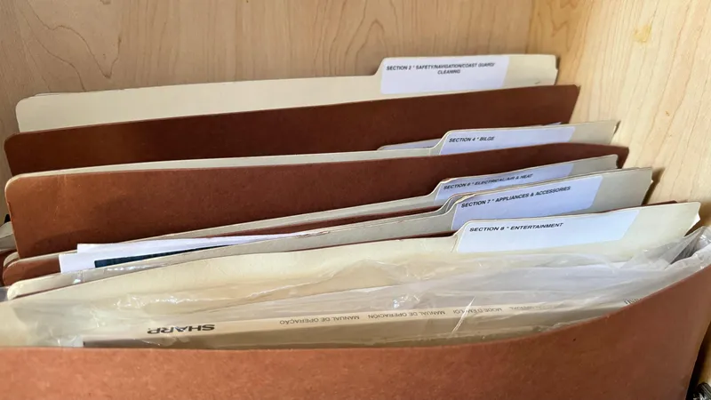 Slide: The Image of Organized file folders in a cabinet, related to Sea Ray 44 Sundancer 2007 model. - 6