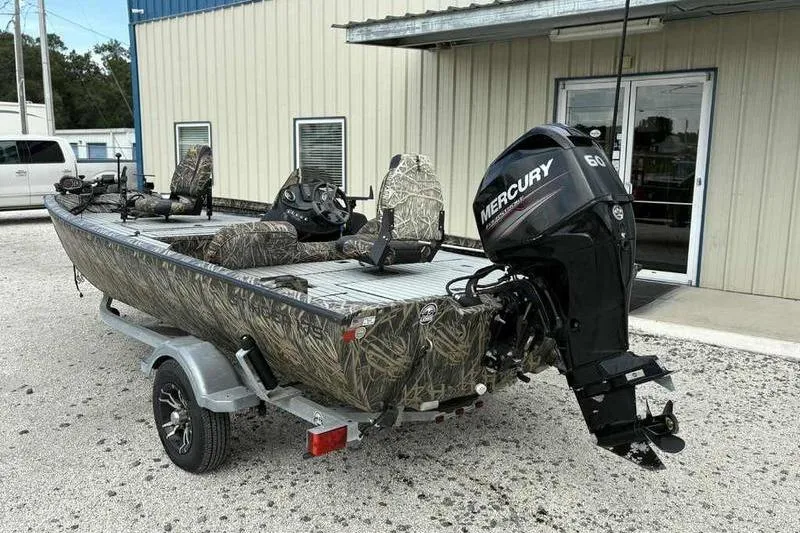 Slide: The Image of 2016 Lowe Stinger 175C boat with camouflage design and Mercury 60 outboard motor. - 13