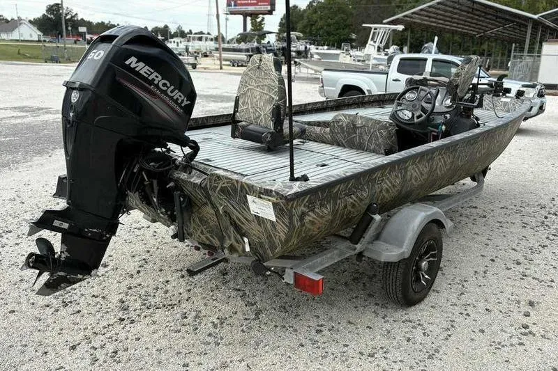 Slide: The Image of 2016 Lowe Stinger 175C boat with Mercury outboard motor on a trailer. - 5