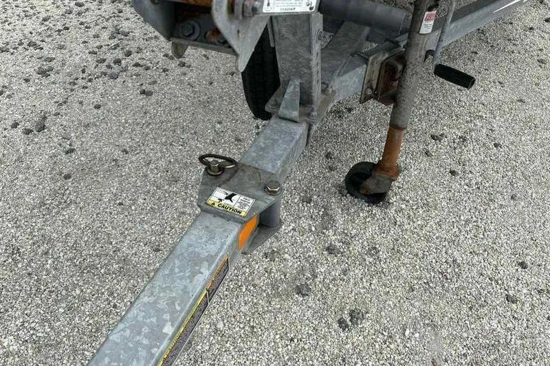 Slide: The Image of Trailer hitch of a 2016 Lowe Stinger 175C on gravel surface. - 7