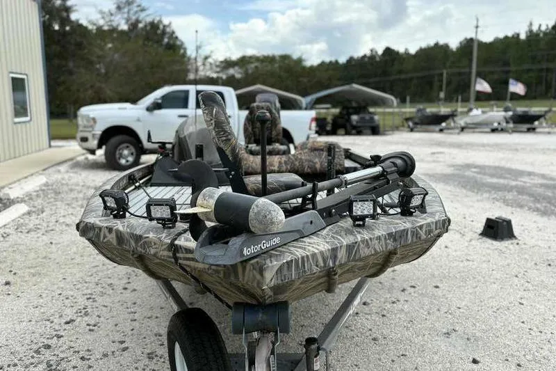 Slide: The Image of 2016 Lowe Stinger 175C fishing boat with camo seats and MotorGuide trolling motor. - 8