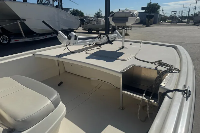 Slide: The Image of 2021 Mako Pro Skiff 19 CC boat interior with seating and equipment on display. - 15