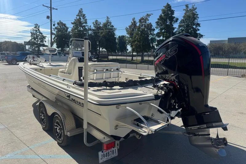 Slide: The Image of 2021 Mako Pro Skiff 19 CC boat on trailer with Mercury Pro XS engine. - 3
