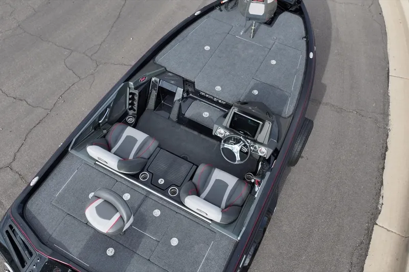 Slide: The Image of 2024 Ranger Z518 boat interior with dual seats and modern dashboard. - 16