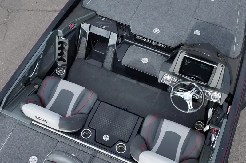 Slide: The Image of 2024 Ranger Z518 boat interior with dual seats, steering console, and storage compartments. - 17