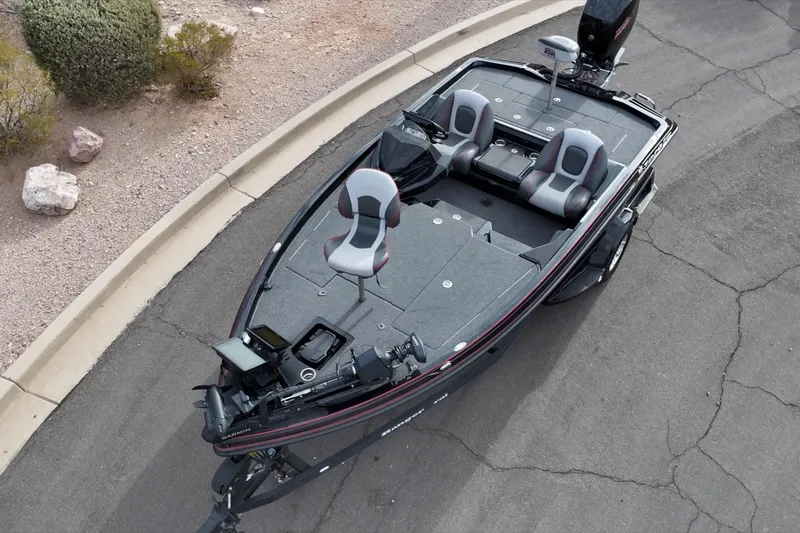 Slide: The Image of 2024 Ranger Z518 boat on pavement, featuring spacious seating and modern design. - 19