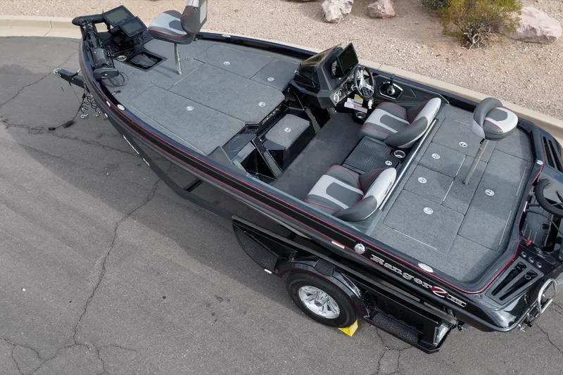 Slide: The Image of 2024 Ranger Z518 fishing boat with spacious deck and modern seating. - 25