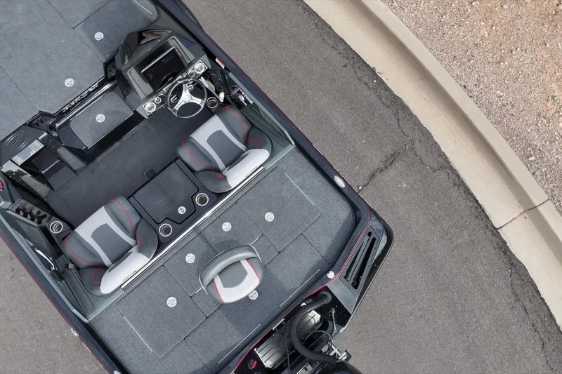 Slide: The Image of 2024 Ranger Z518 boat interior with dual seats and steering console, viewed from above. - 5