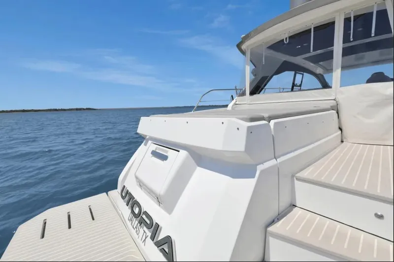 Slide: The Image of 2020 Azimut 51 Atlantis yacht cruising on serene blue waters. - 10