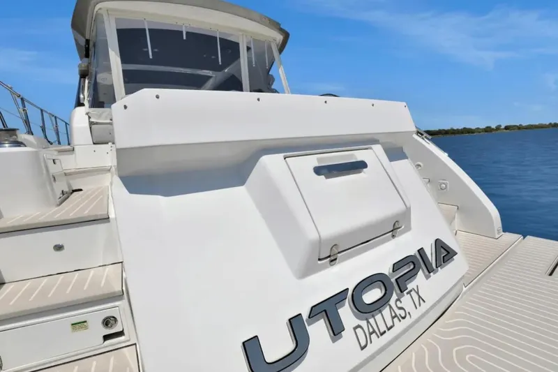 Slide: The Image of Azimut 51 Atlantis 2020 yacht on calm blue waters, rear view. - 11