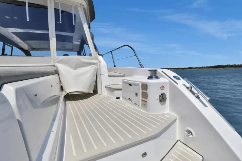 Slide: The Image of 2020 Azimut 51 Atlantis yacht on open water, showcasing sleek design and luxury features. - 14