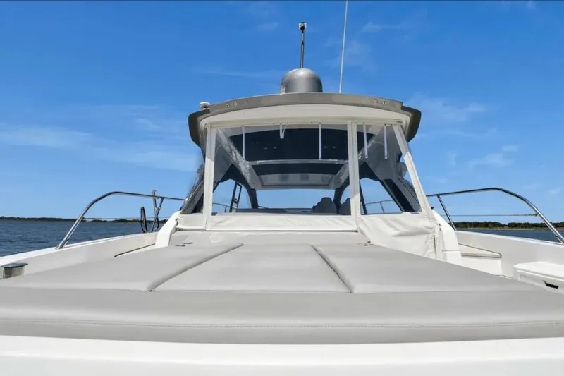 Slide: The Image of Azimut 51 Atlantis 2020 yacht on serene water with clear blue sky. - 16