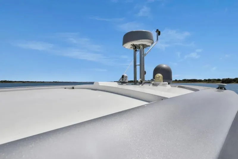 Slide: The Image of 2020 Azimut 51 Atlantis yacht cruising on open water under clear blue skies. - 22