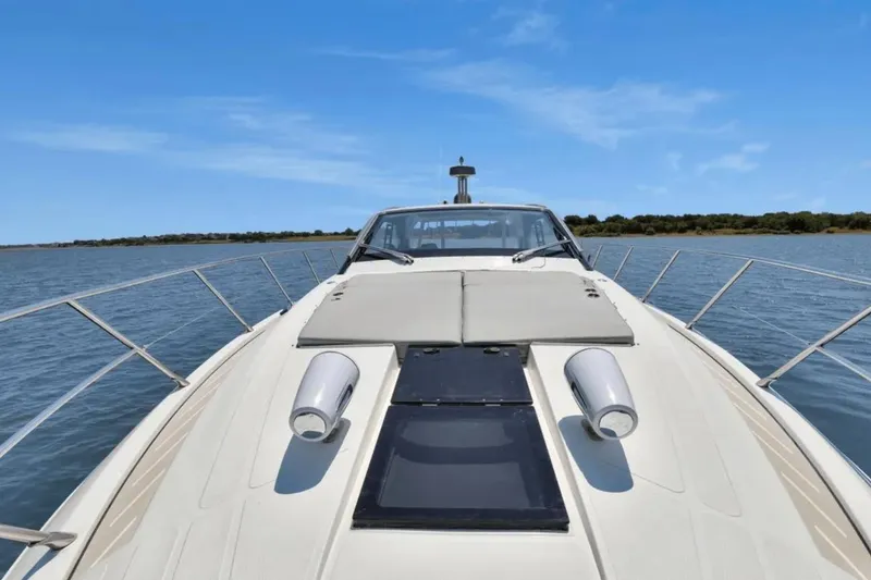 Slide: The Image of 2020 Azimut 51 Atlantis yacht deck with radar, under clear blue sky. - 23