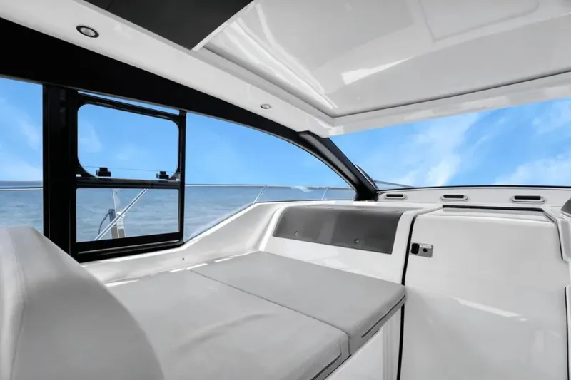 Slide: The Image of Interior of 2020 Azimut 51 Atlantis yacht with modern seating and table, overlooking water. - 29