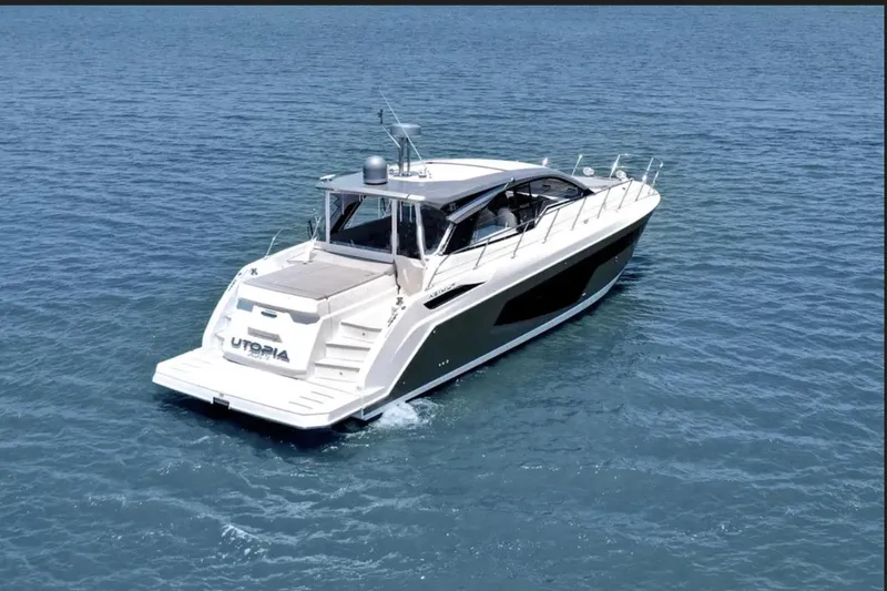 Slide: The Image of 2020 Azimut 51 Atlantis yacht cruising on calm blue waters. - 3