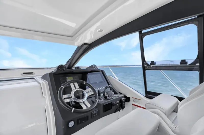 Slide: The Image of Interior view of 2020 Azimut 51 Atlantis yacht cockpit with steering wheel and seating. - 33
