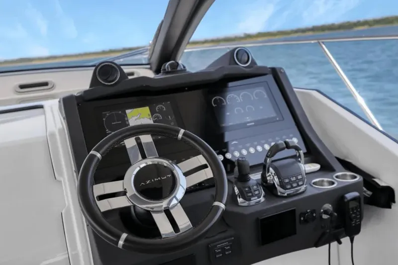 Slide: The Image of Cockpit of 2020 Azimut 51 Atlantis yacht with modern steering and navigation controls. - 34