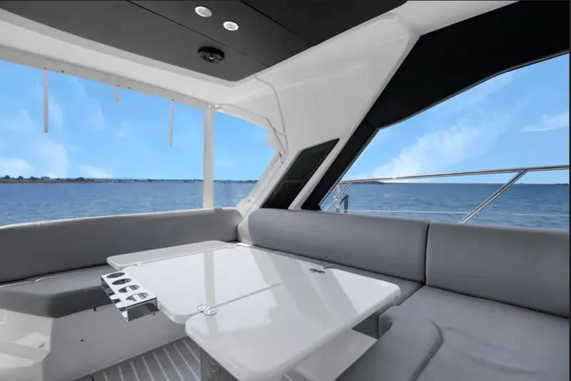 Slide: The Image of Cockpit of 2020 Azimut 51 Atlantis yacht with steering wheel and control panel. - 36