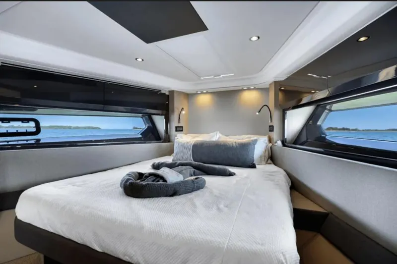 Slide: The Image of Luxurious bedroom interior of 2020 Azimut 51 Atlantis yacht with scenic window views. - 54
