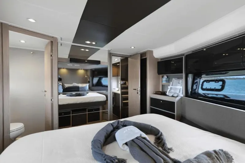 Slide: The Image of Luxurious bedroom interior of 2020 Azimut 51 Atlantis yacht with scenic ocean views. - 55