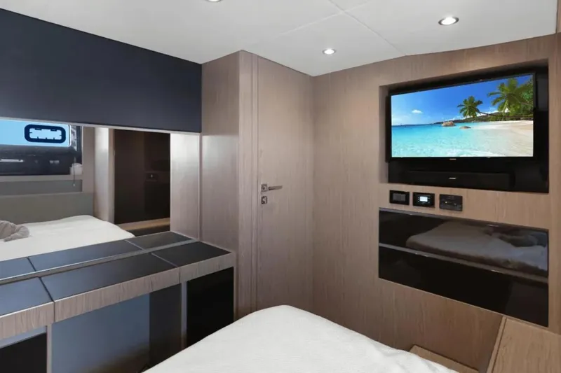 Slide: The Image of Luxurious bedroom interior of 2020 Azimut 51 Atlantis yacht with TV and window view. - 61