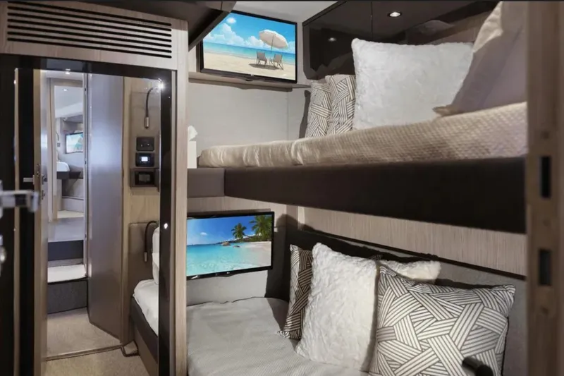 Slide: The Image of Luxurious interior of 2020 Azimut 51 Atlantis yacht with cozy bunk beds and modern decor. - 64