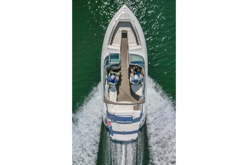 Slide: The Image of Overhead view of a 2003 Cobalt 240 boat cruising on water. - 10